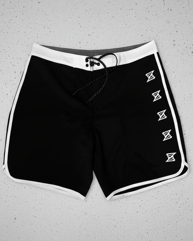 Black boardshorts with white accents on a white background
